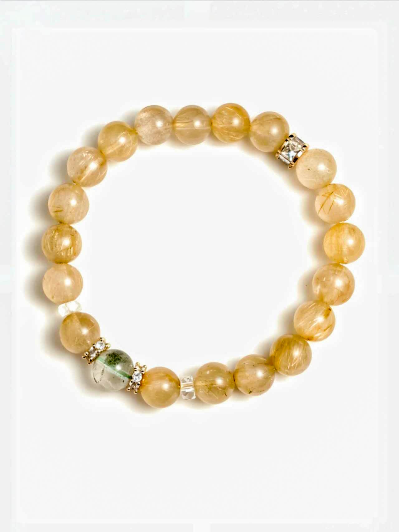 Beaded bracelet with yellow and clear beads on a white background