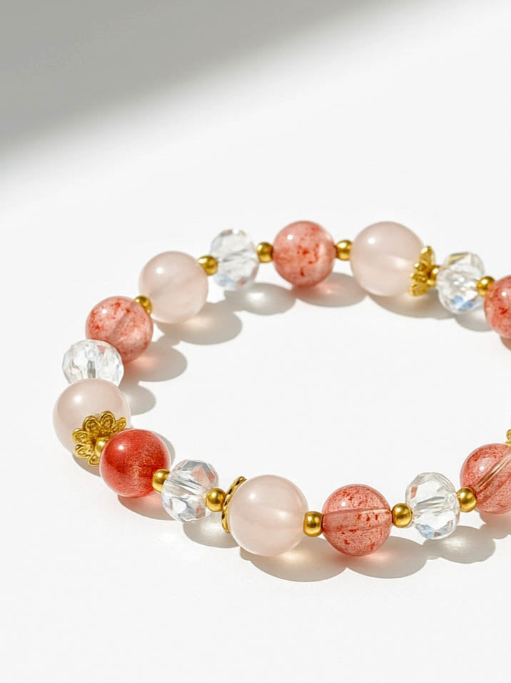 Bracelet with pink and clear beads on a white background