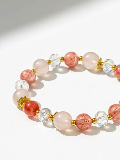 Bracelet with pink and clear beads on a white background