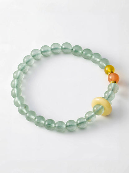 Green beaded bracelet with colorful beads on a white background