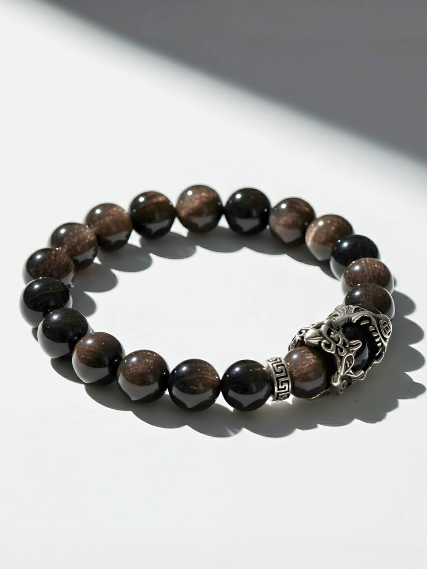 Beaded bracelet with a silver clasp on a white background