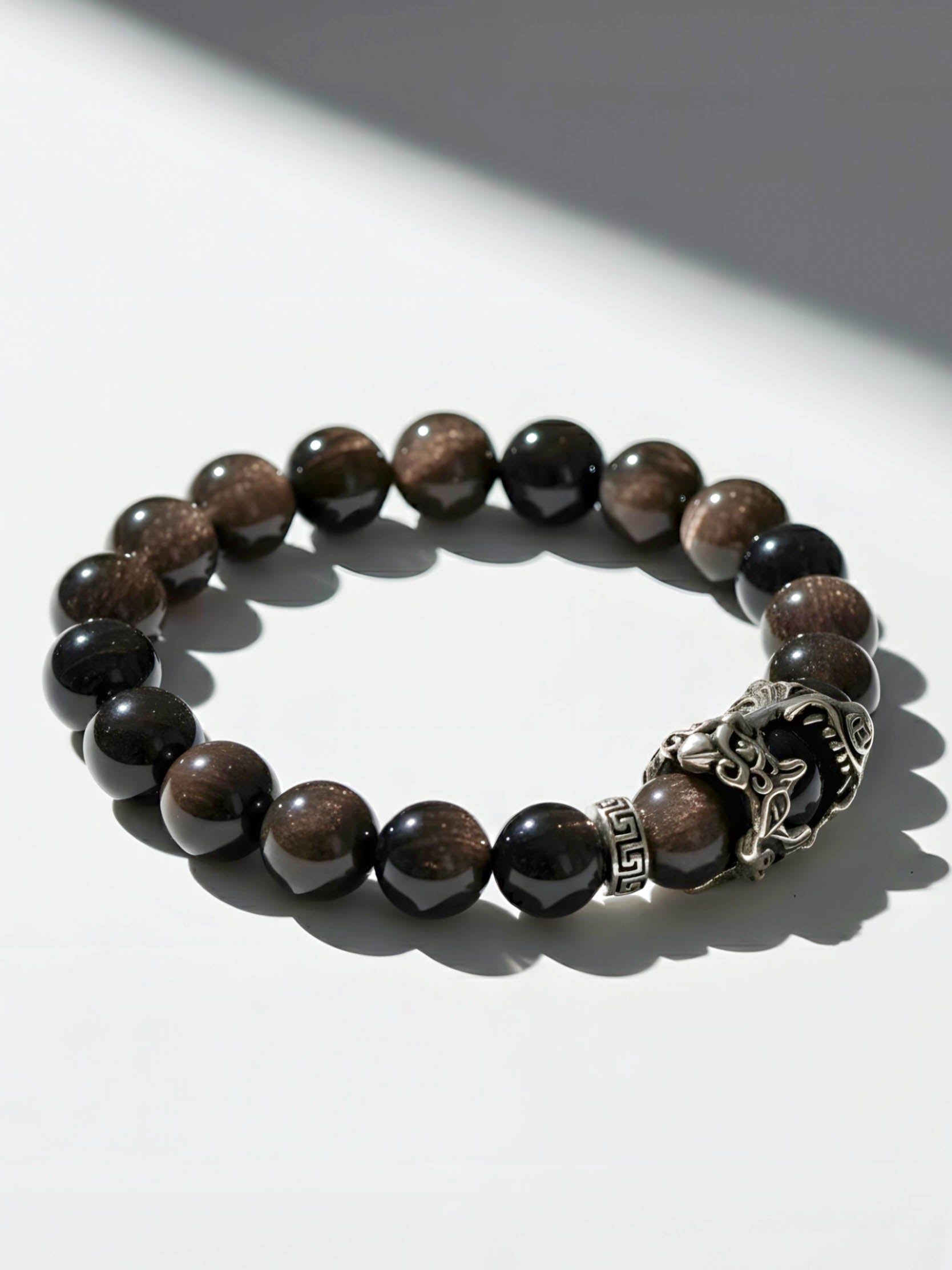 Beaded bracelet with a silver clasp on a white background