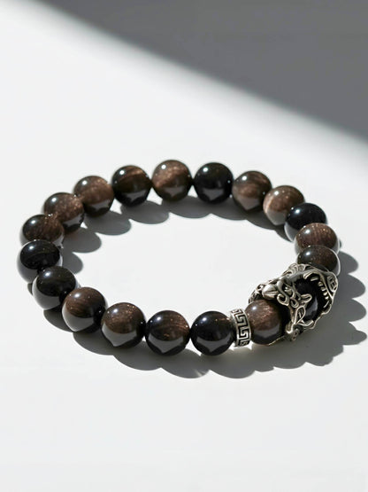 Beaded bracelet with a silver clasp on a white background