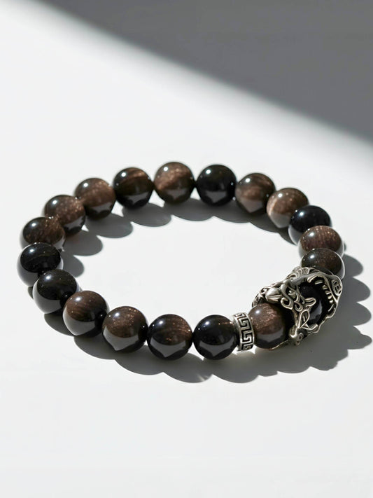 Beaded bracelet with a silver clasp on a white background