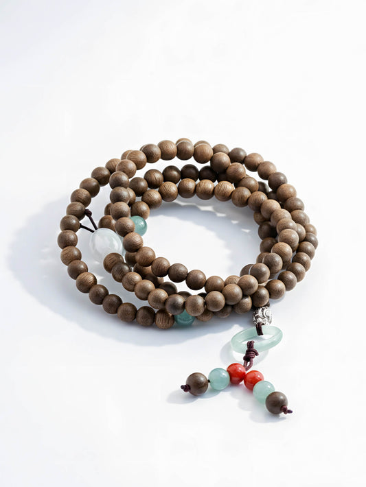 Wooden beaded necklace with colorful accents on a white background