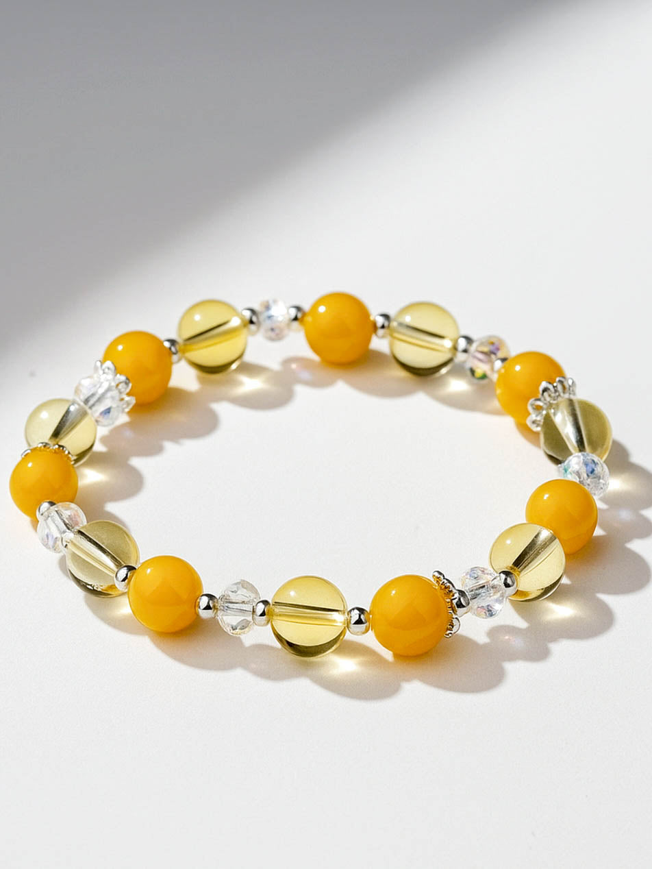 Bracelet with yellow beads on a white background