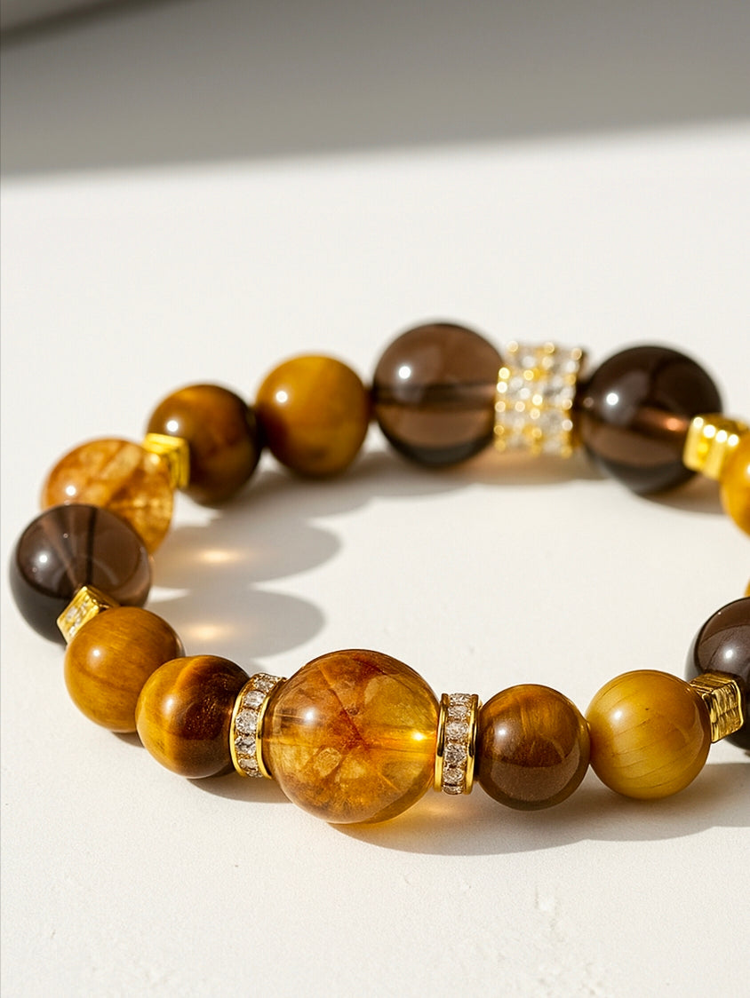 Beaded bracelet with brown and gold beads on a white surface