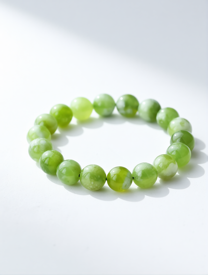 Green beaded bracelet on a white background